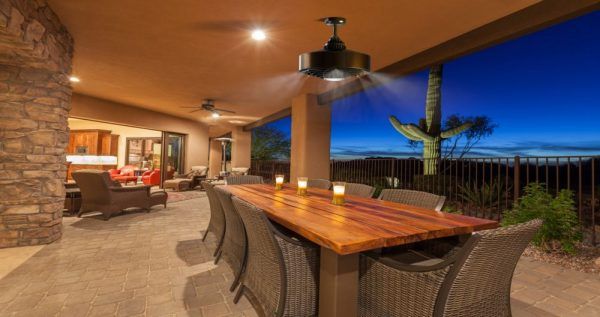 overhead misting fans above table